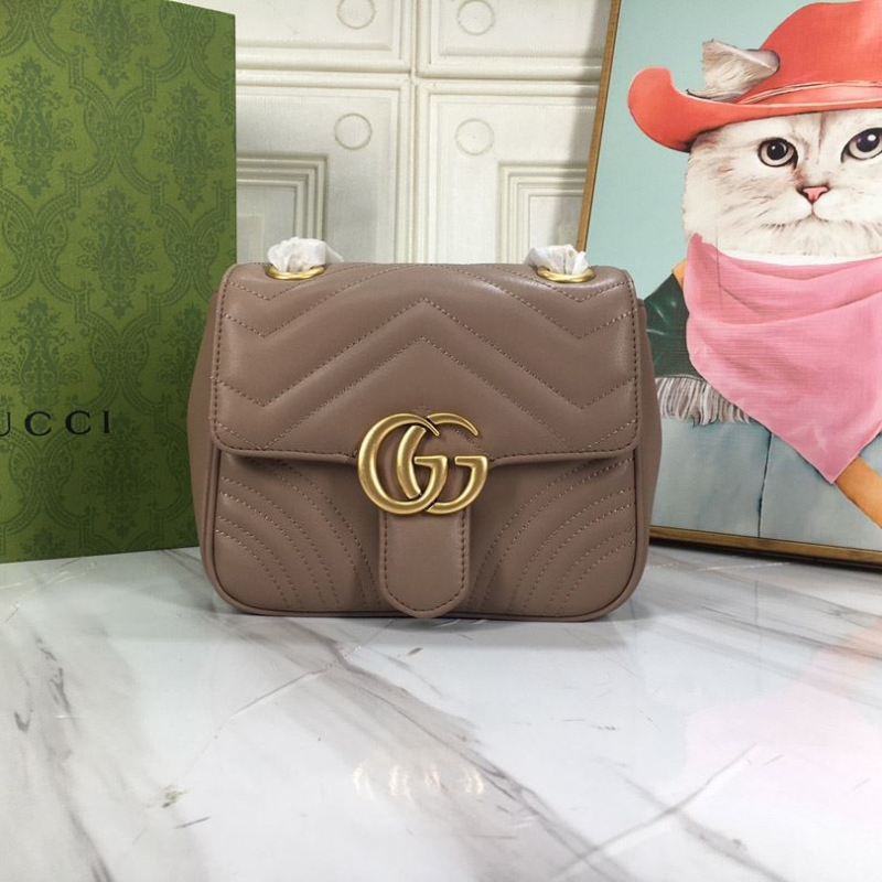 G*u*i clutch bags